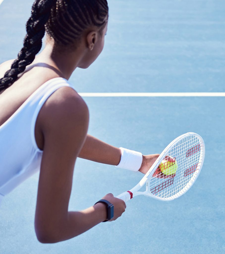 web-asm-tennis-final This is an image of a young female athlete preparing to serve a tennis ball.